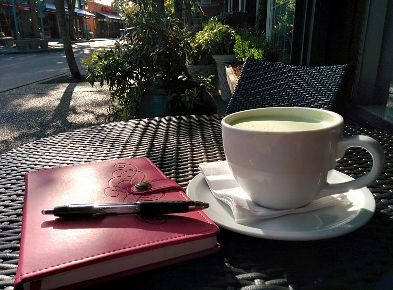 Energy Boosting Tea Recipes A Cup of Tea on a Table Outside with a Journal On the Table