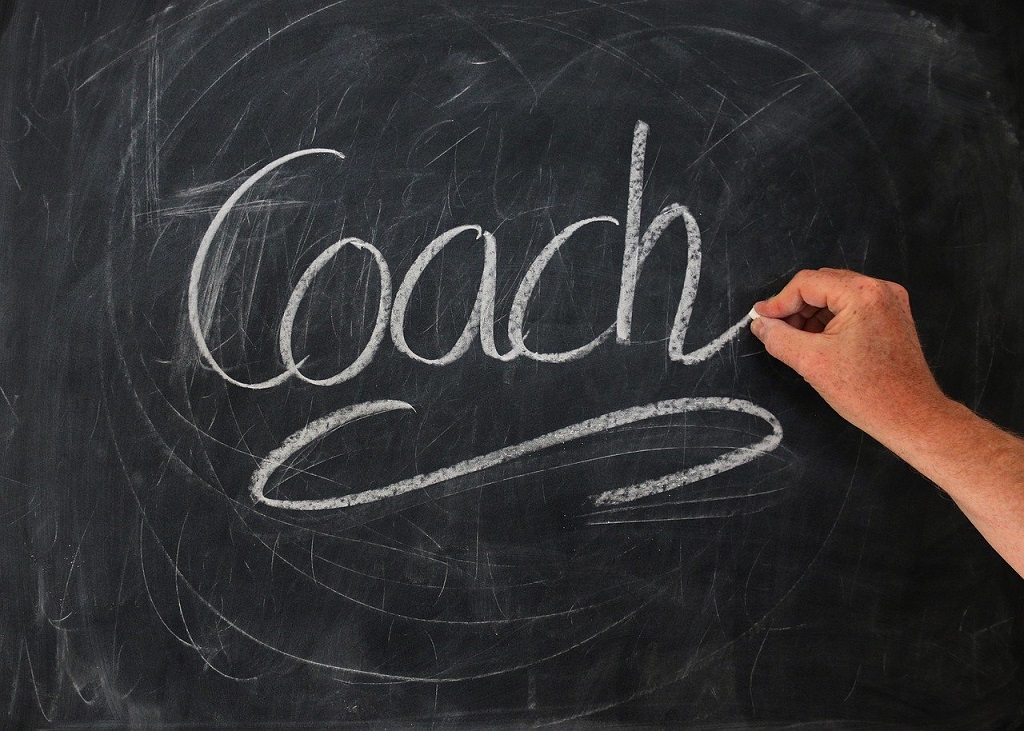 Become a Coach Program The Word "Coach" Written on a Chalkboard