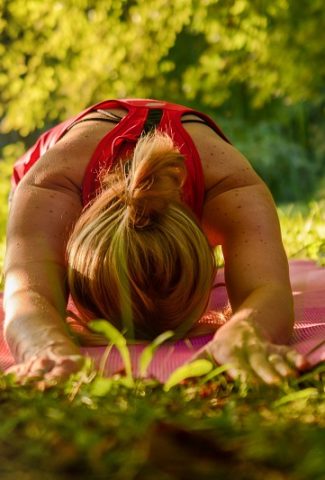 Monday Motivation Quotes Close Up of a Woman Doing Yoga in a Park